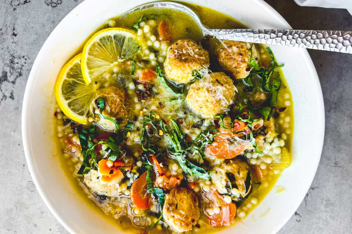 Overhead image of a bowl of Italian wedding soup.