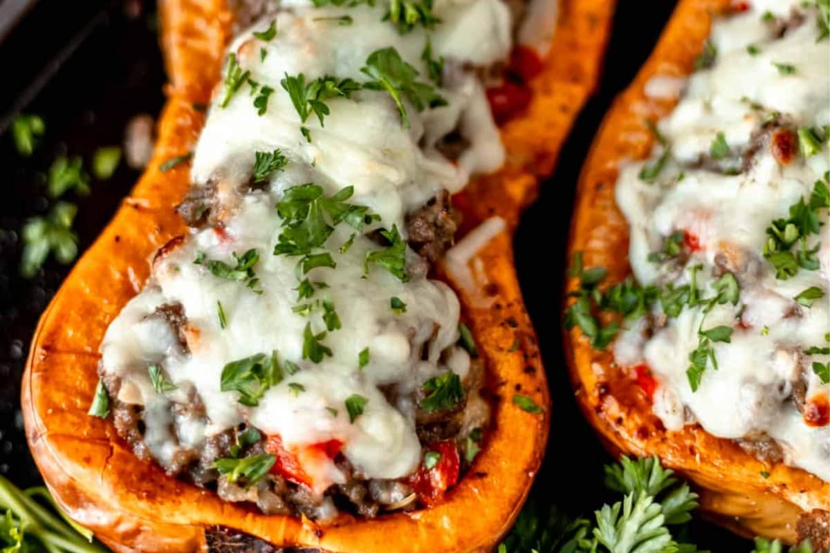 Stuffed butternut squash on a tray.