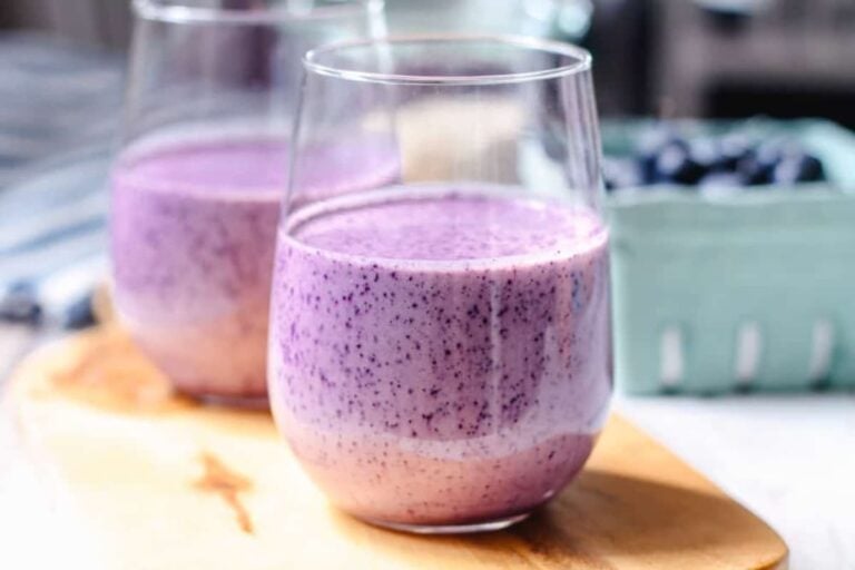 A glass of blueberry smoothie.