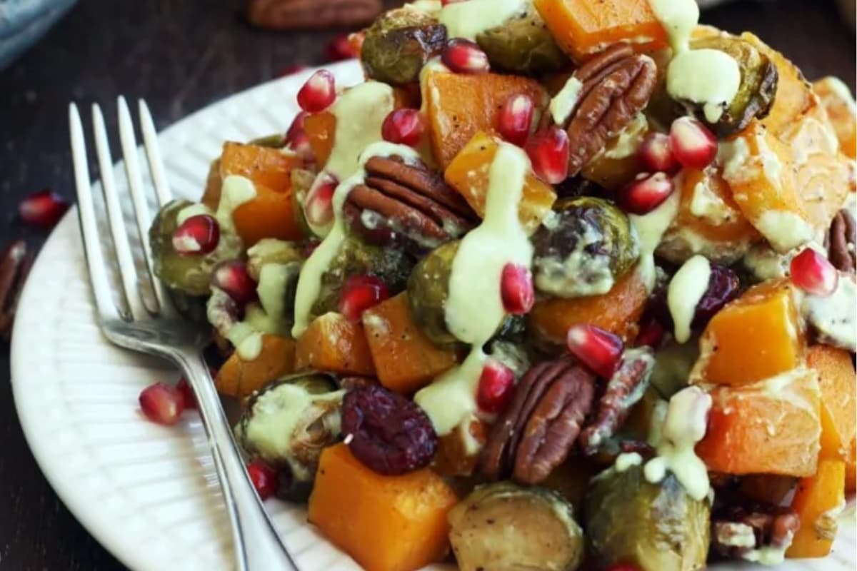 A plate of brussels sprouts and butternut squash.