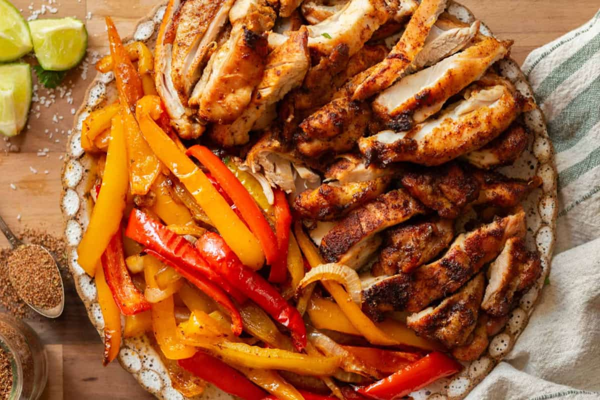 A plate of chicken with peppers.