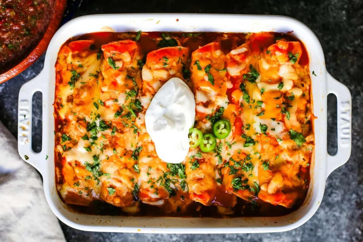 A dish of chicken enchiladas.