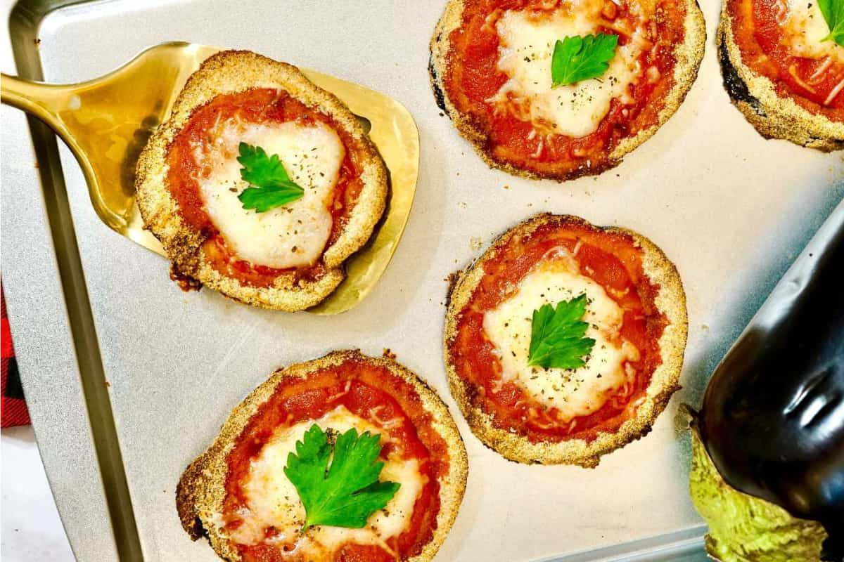 A sheet pan of eggplant parmesan.