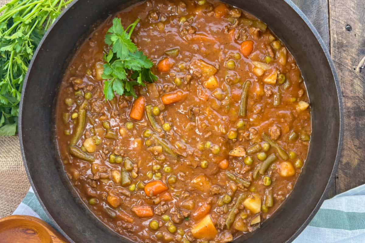 A Dutch oven of ground beef stew.