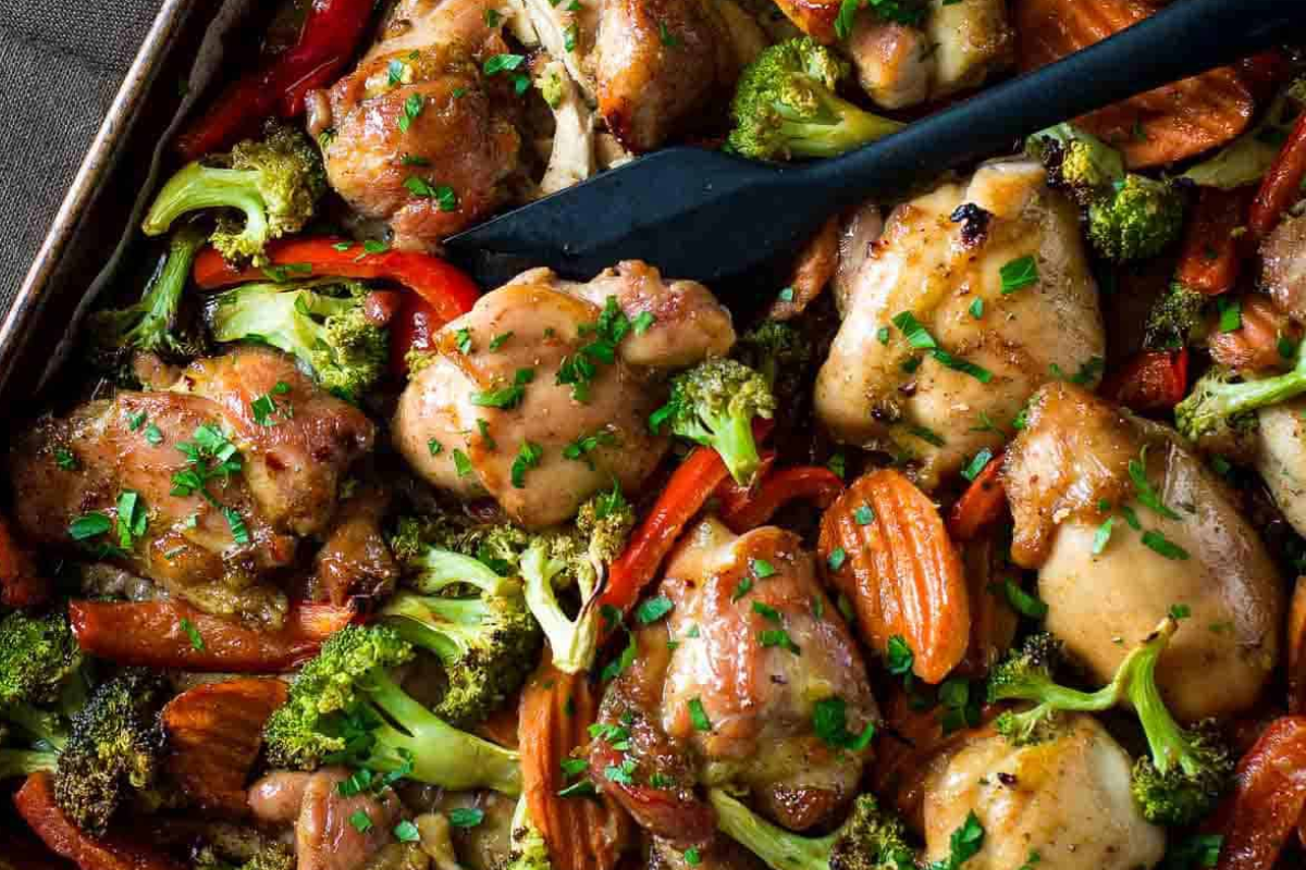 A honey garlic chicken dinner on a sheet pan.