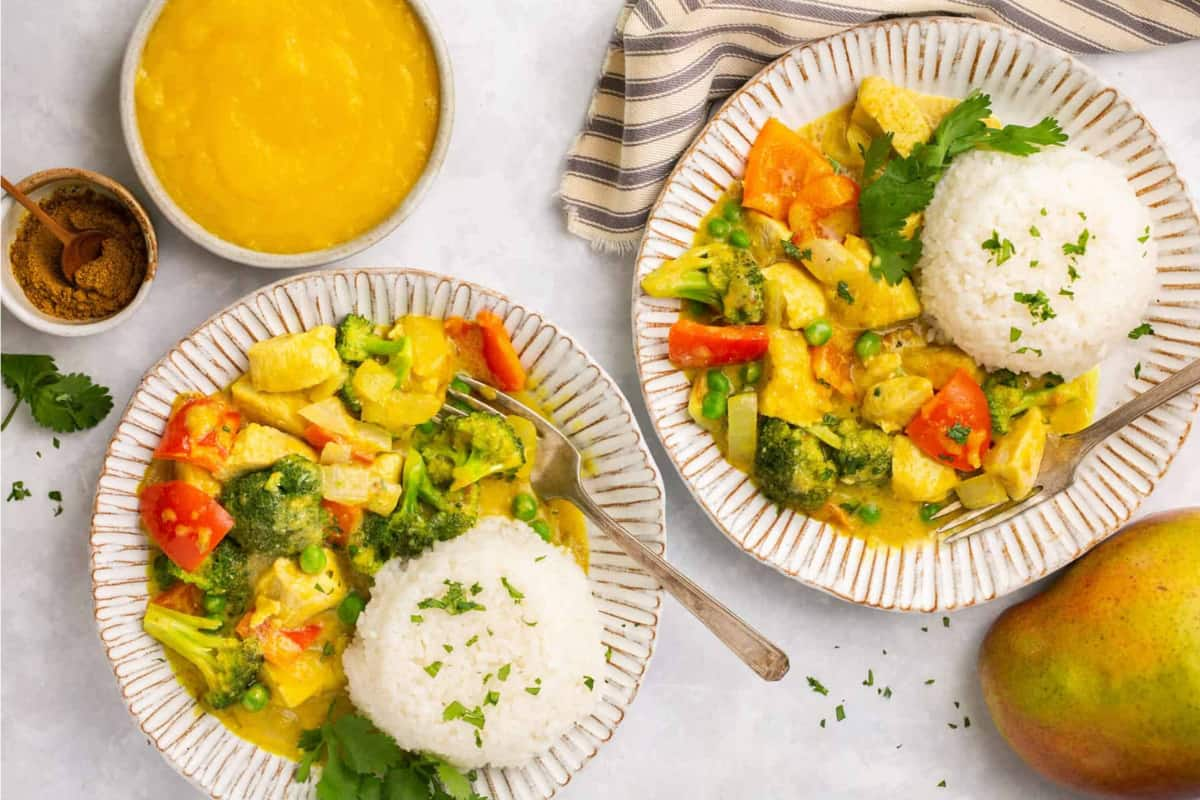 Bowls of mango chicken curry.