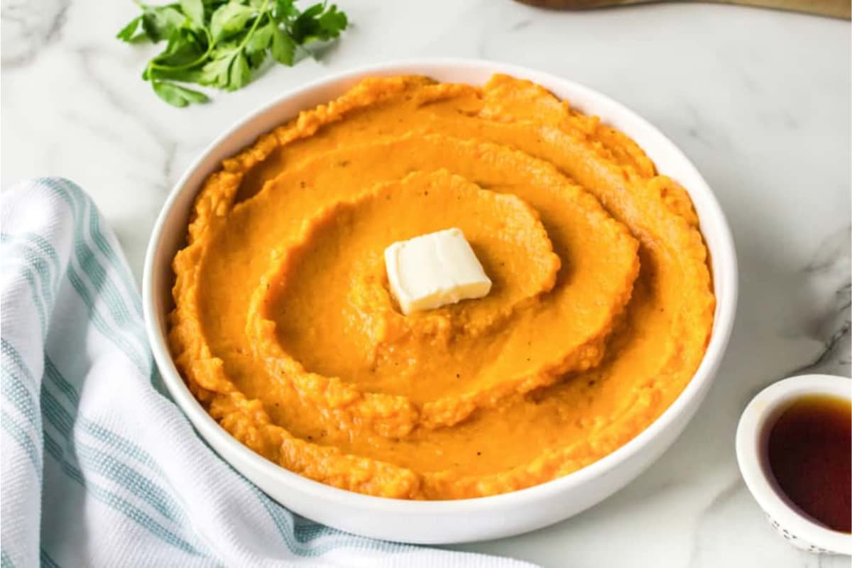 A bowl of mashed sweet potatoes.