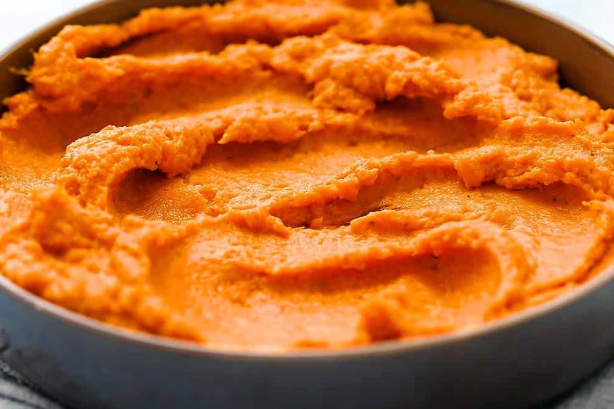 A bowl of mashed sweet potatoes.