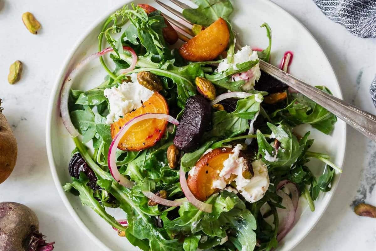 A plate of roasted beet salad.