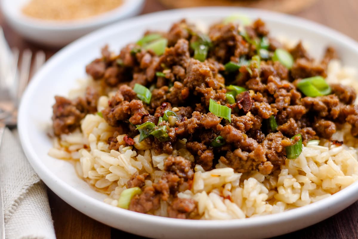 Spicy sesame ground beef bowls on a table.