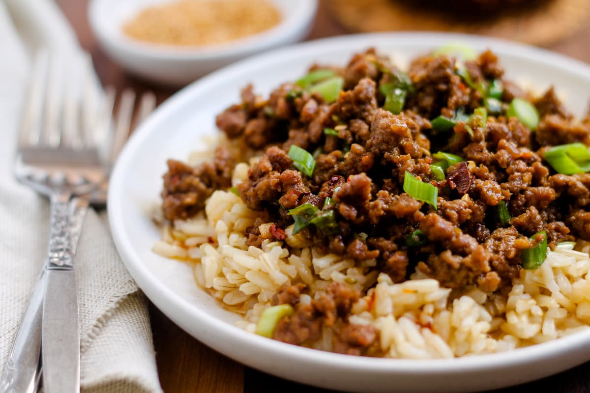 Spicy sesame ground beef bowls on a table.