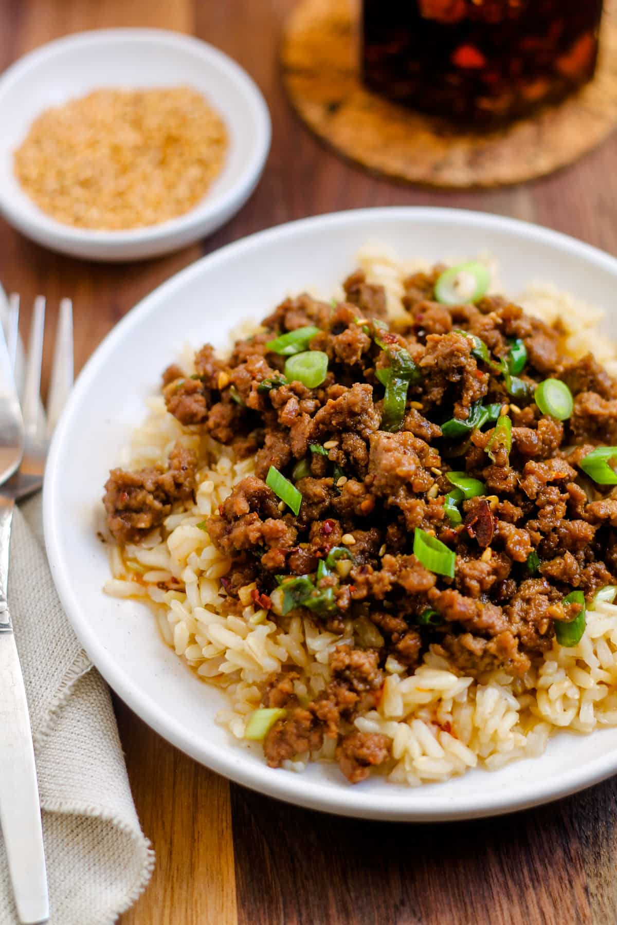 Spicy sesame ground beef bowls on a table.