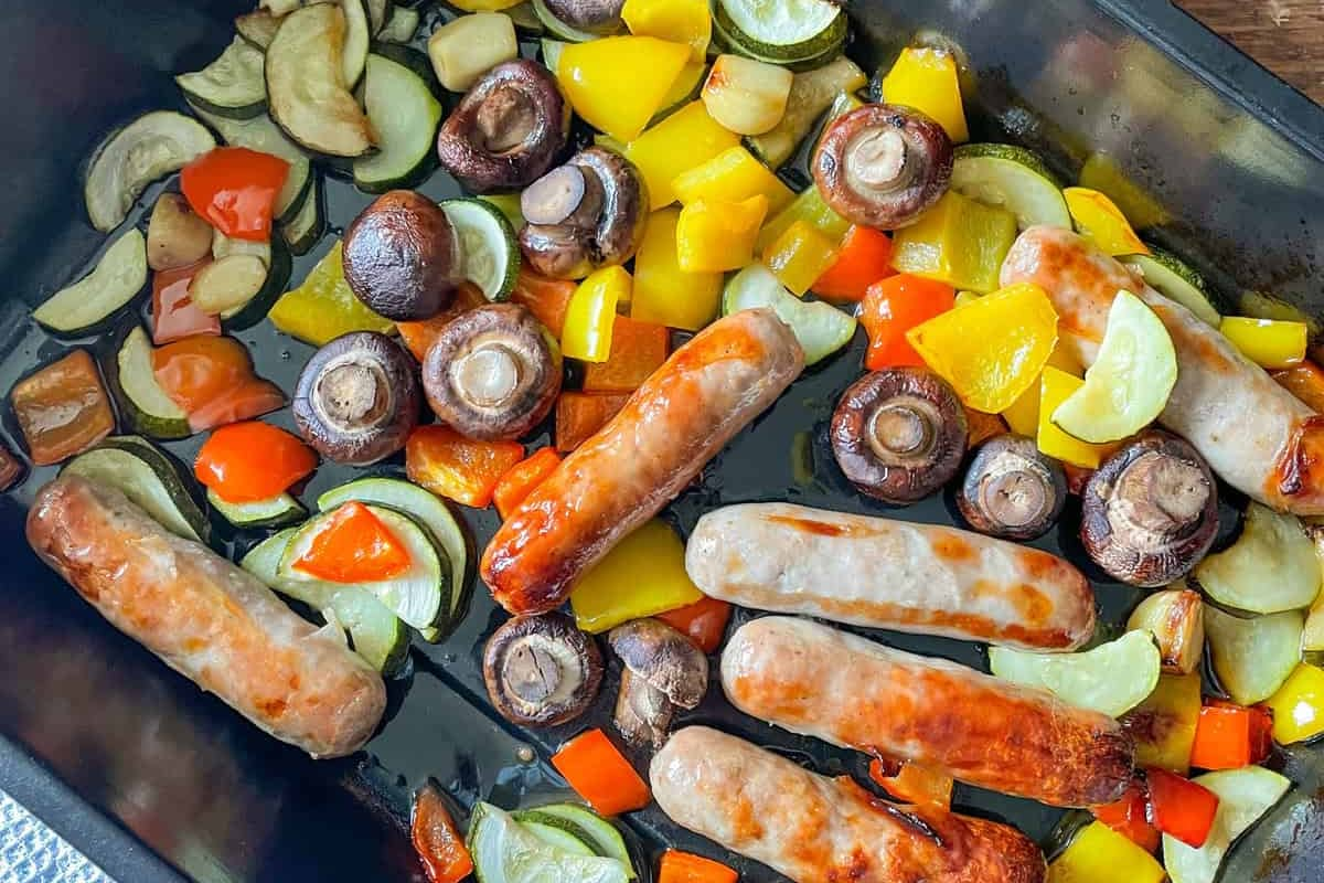 A sheet pan of hot honey sausages.