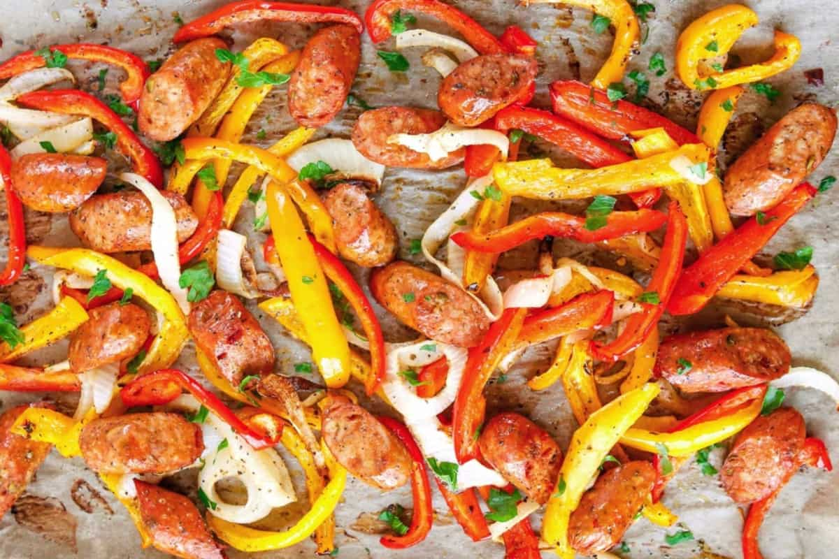 Overhead image of sheet pan sausage and peppers.