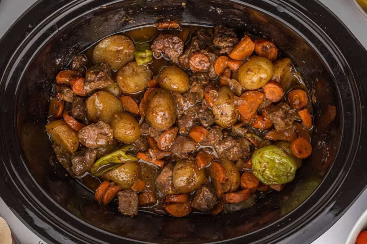 A slow cooker with mississippi beef stew.