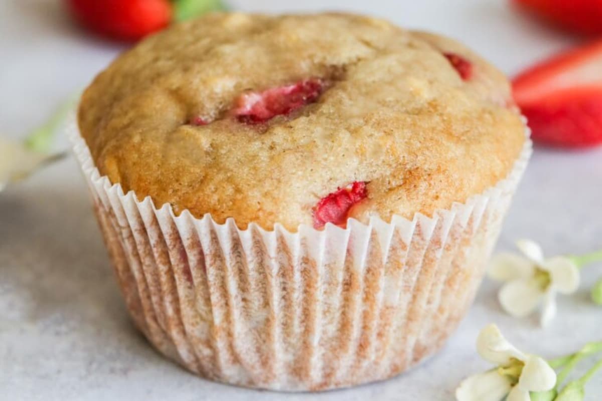 A plate of strawberry banana muffins.