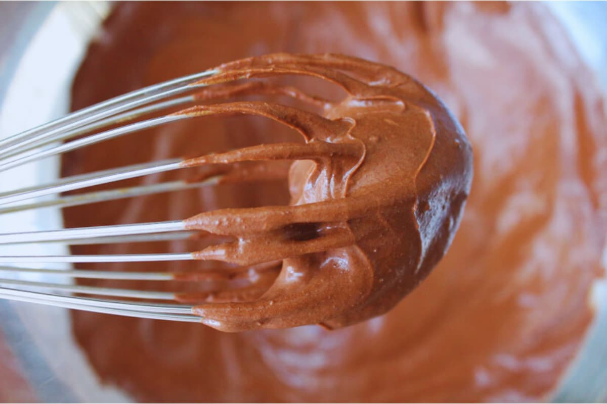 A whisk of vegan chocolate frosting.