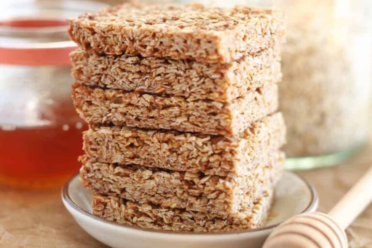 A stack of baked honey oatmeal bars.