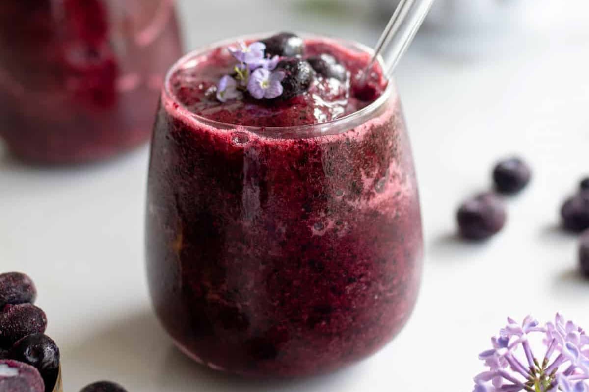 A glass of blueberry kombucha.