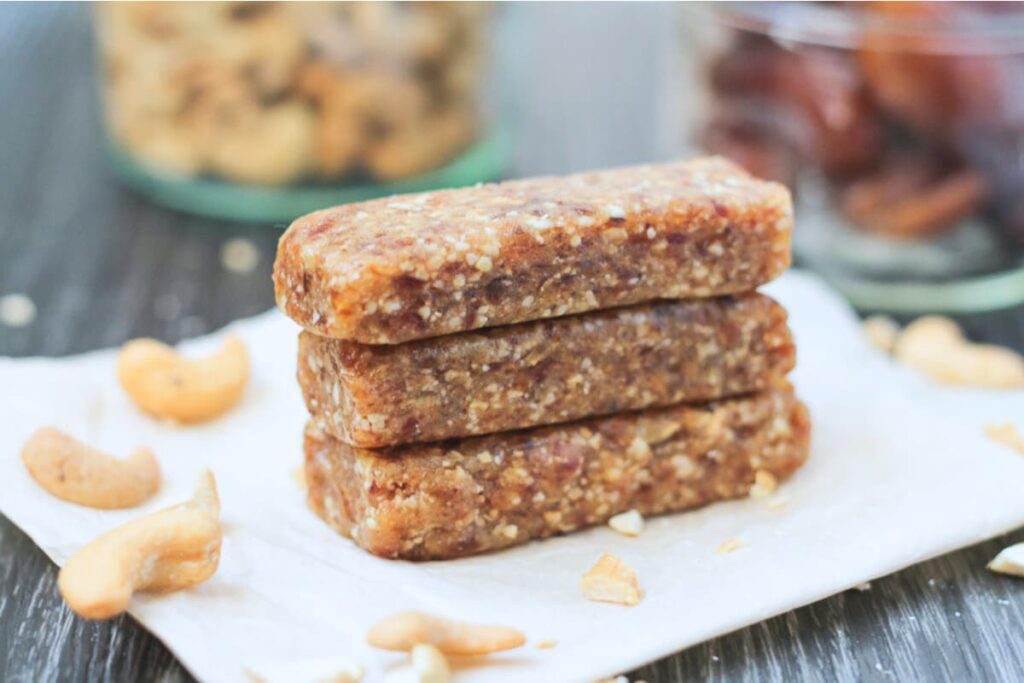 A stack of homemade cashew cookie larabars.