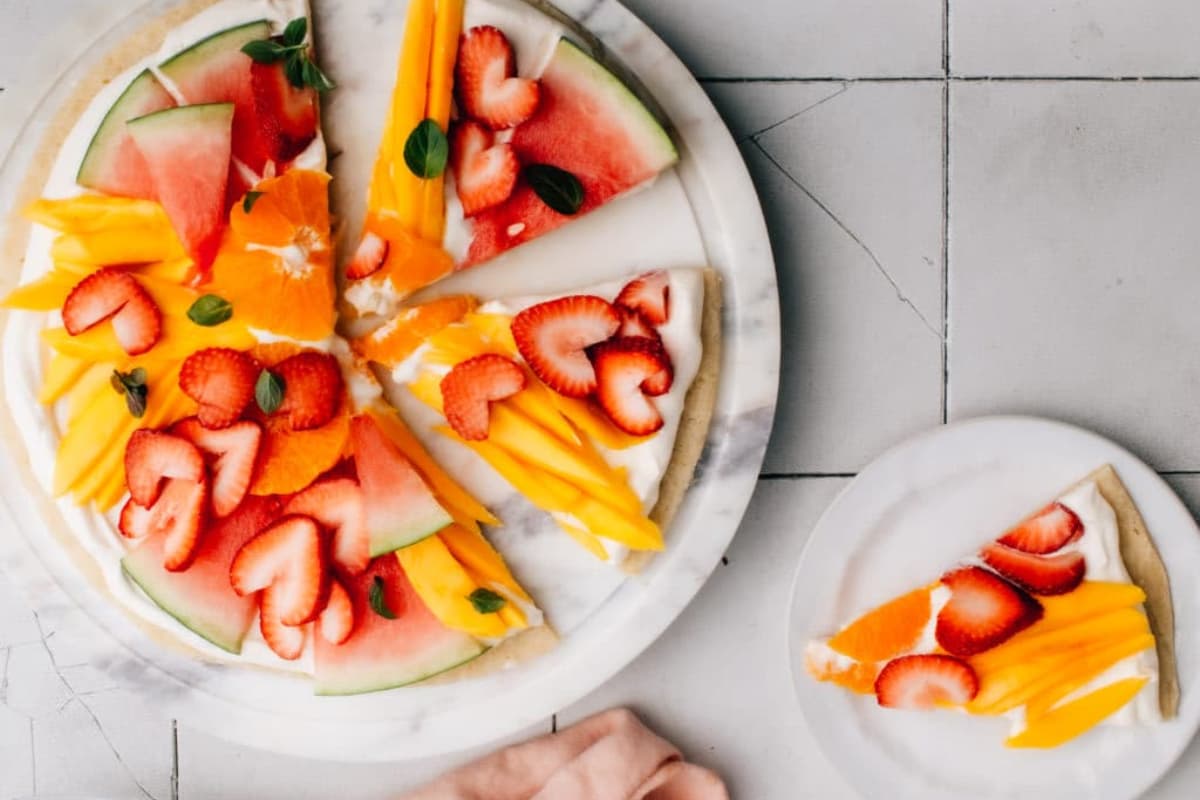 A plate of fruit pizza.