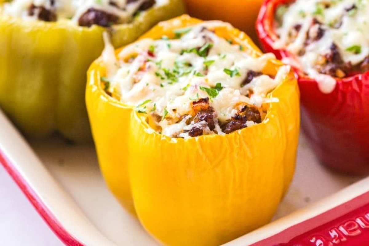 A tray of italian stuffed peppers.