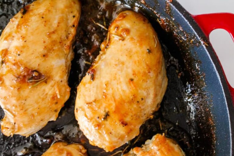 Maple mustard glazed chicken in a pan.