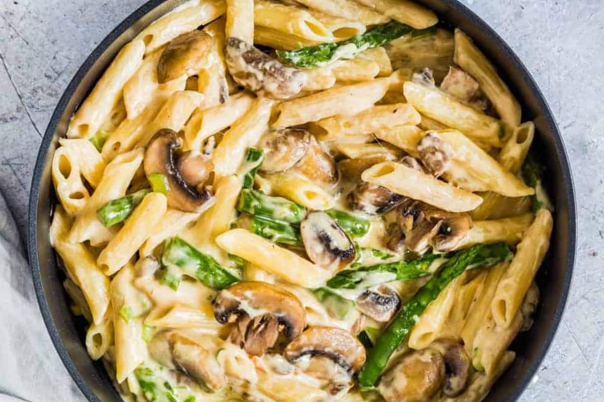 A bowl of mushroom asparagus pasta.