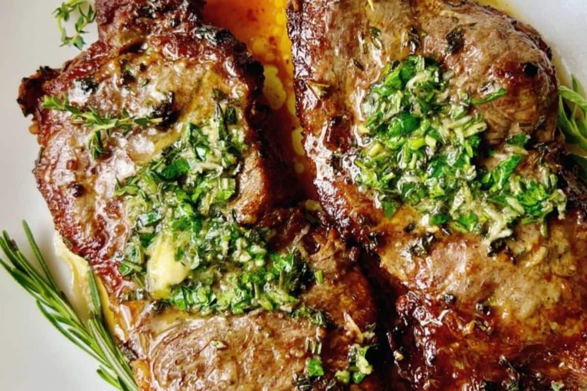 A plate of NY strip steaks.