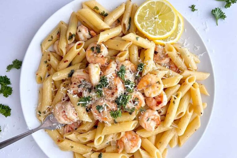 A bowl of shrimp scampi penne pasta.