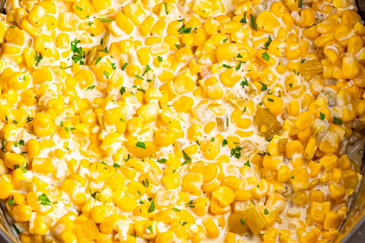 Slow cooker creamed corn overhead image.