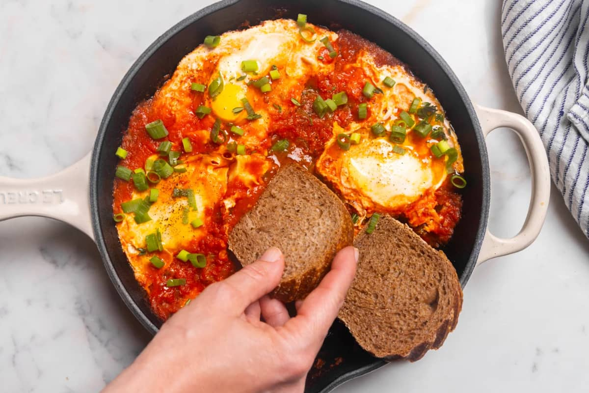 A dish of spicy eggs and tomato.