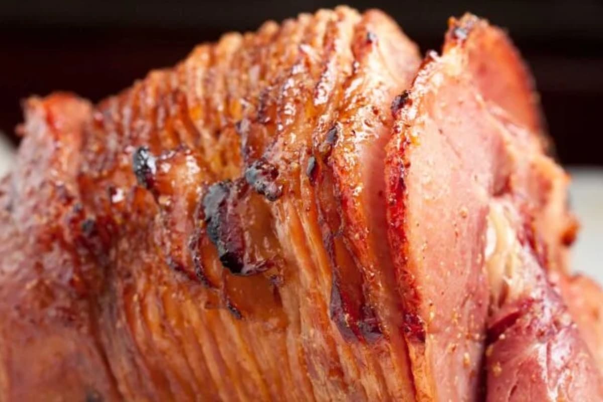 An image of sliced baked honey ham.