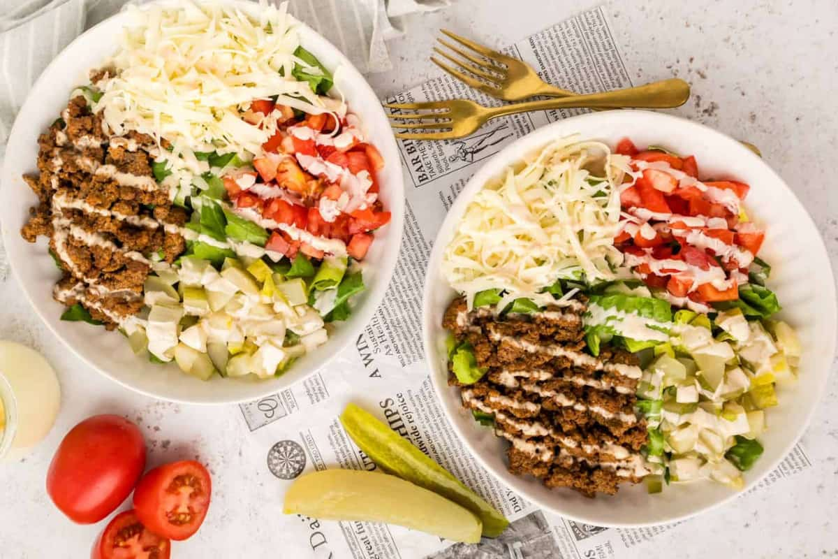 Two bowls of cheeseburger salad.