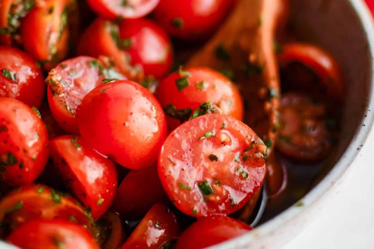 A bowl of cherry tomato salad.