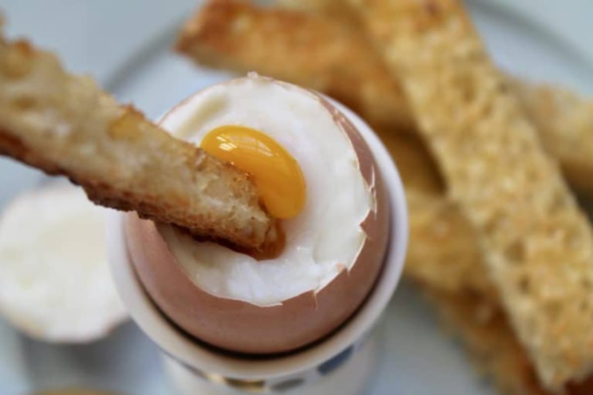 Soldiers being dipped into dippy eggs.