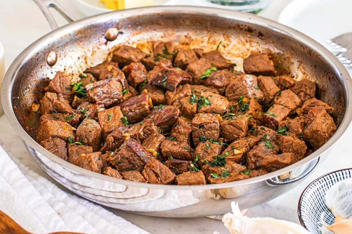 A pan of garlic butter steak bites.