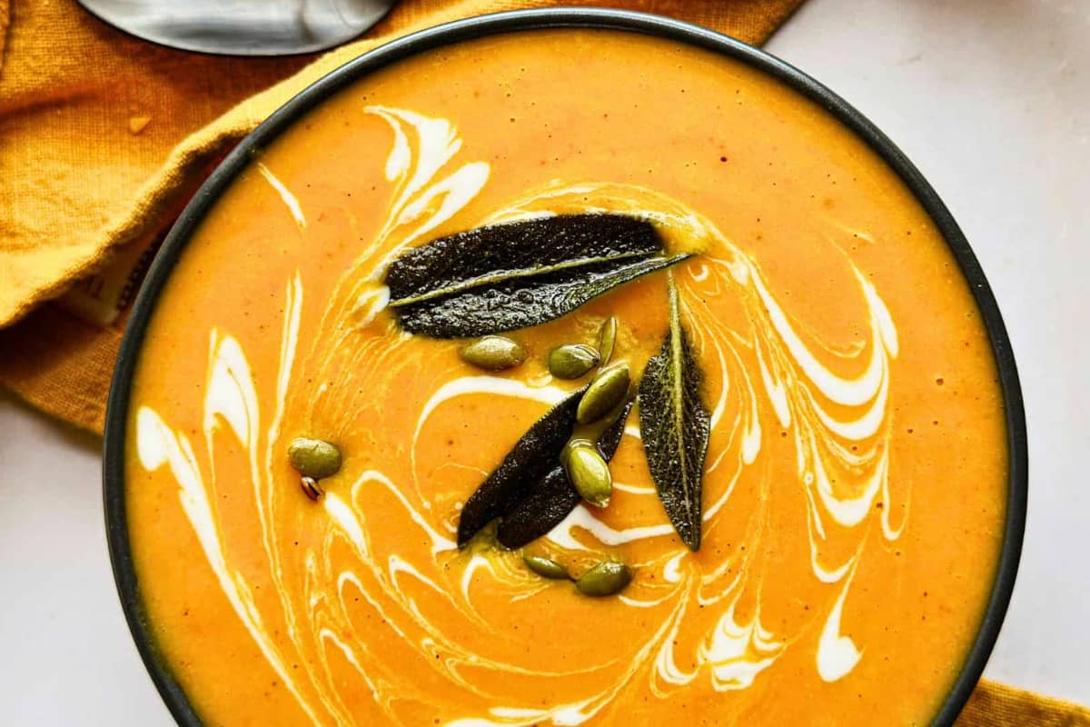 A bowl of butternut squash carrot soup.