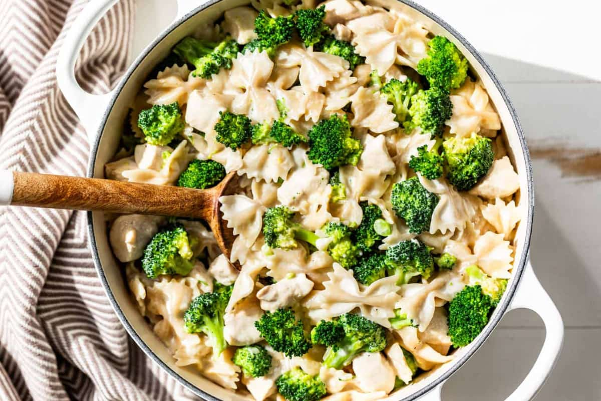 A pot of chicken alfredo broccoli pasta.