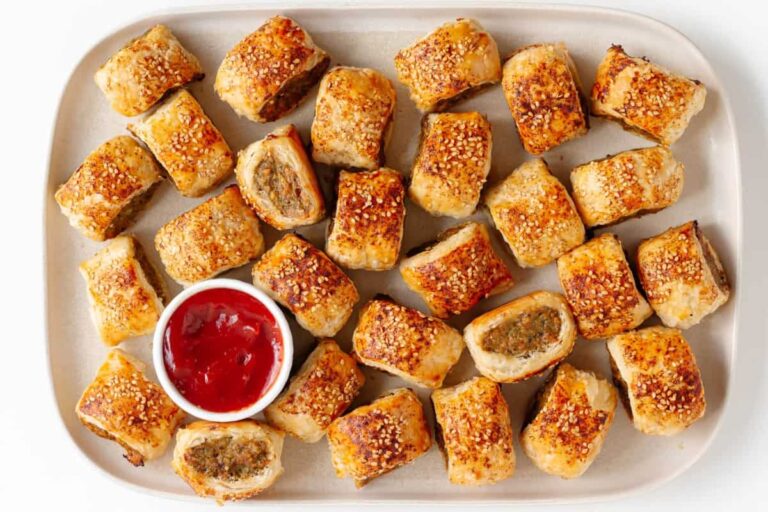 A plate of chicken sausage rolls.