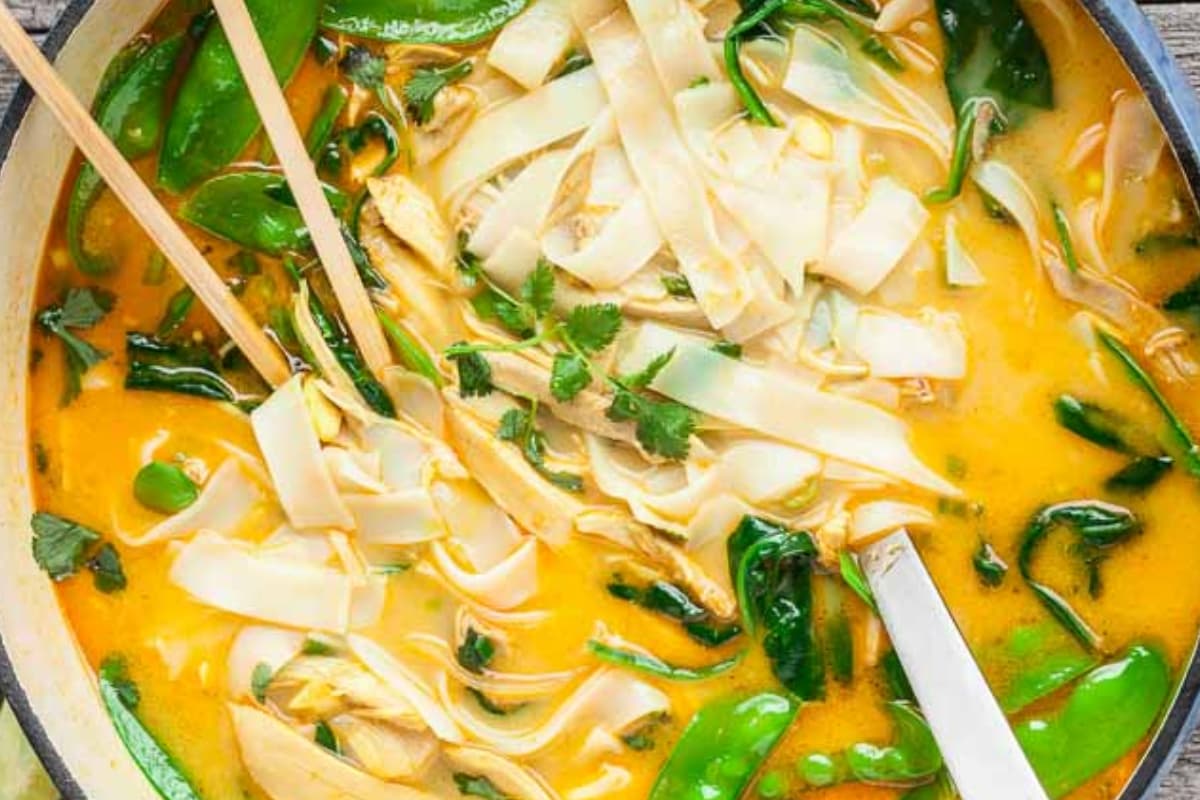 A bowl of coconut curry chicken noodle soup.