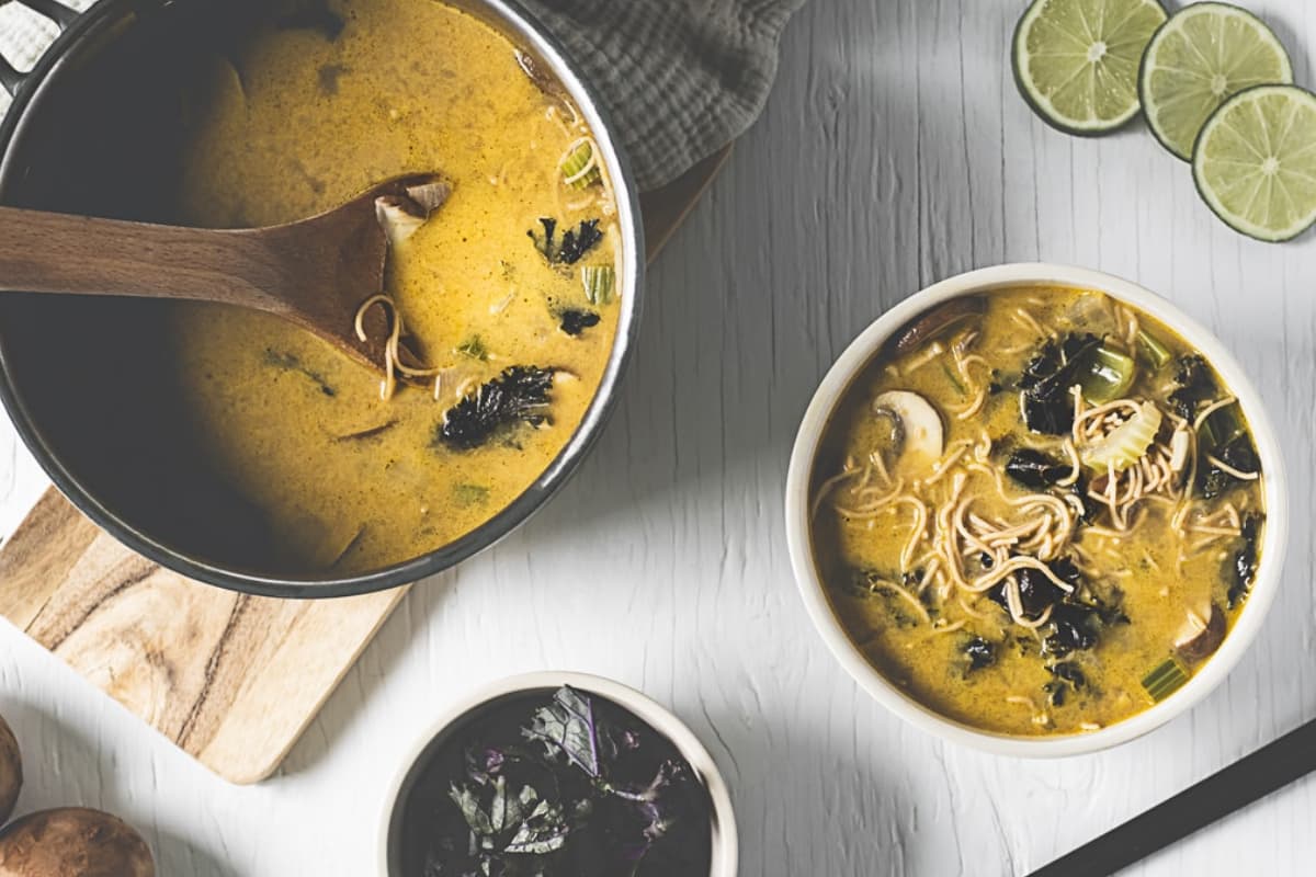 A bowl of coconut lime chicken soup.