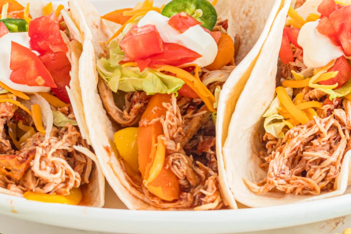 A plate of crock pot chicken tacos.