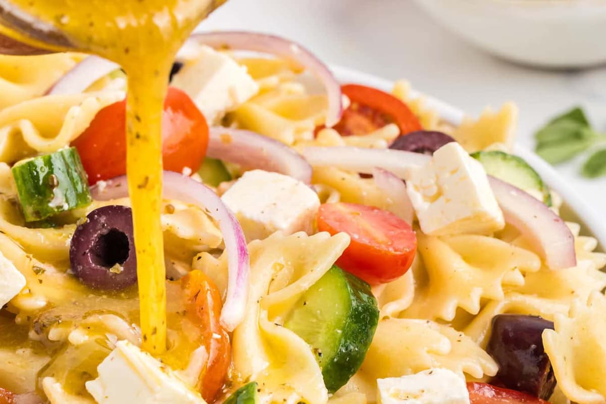 A closeup image of greek pasta salad.