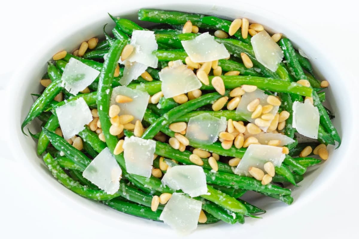 A platter of garlic butter green beans.