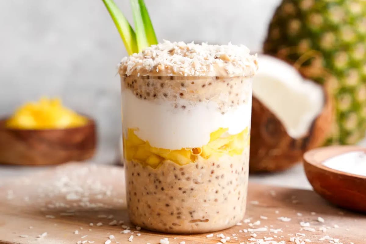 A jar of high protein pina colada overnight oats.