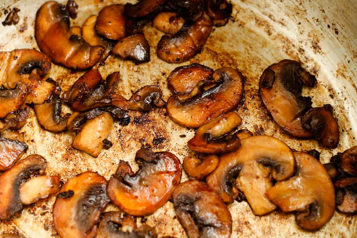 Mushrooms cooking in a pot.