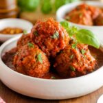 A bowl of Nyuszi's homemade meatballs and sauce.