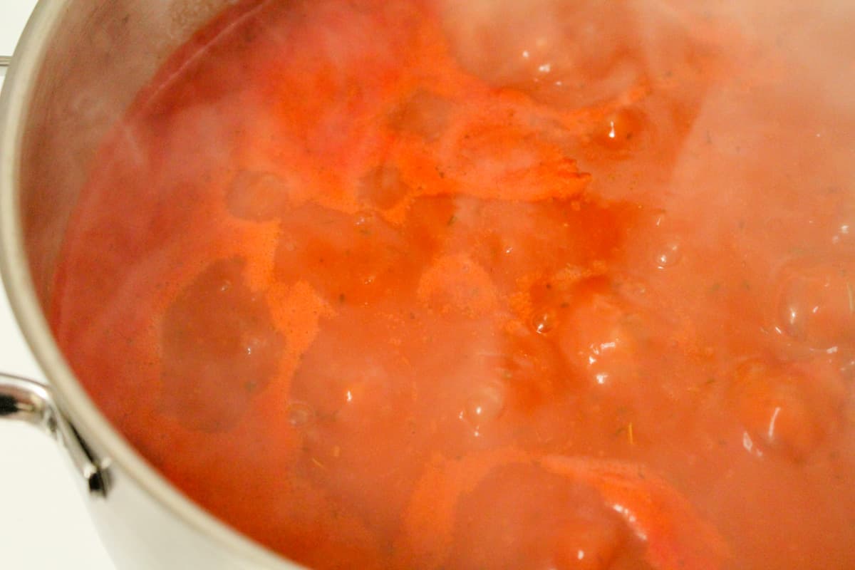 Sauce cooking in pot on the stove.