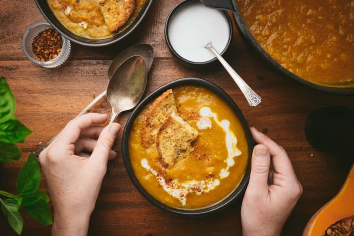 A bowl of pumpkin curry soup.